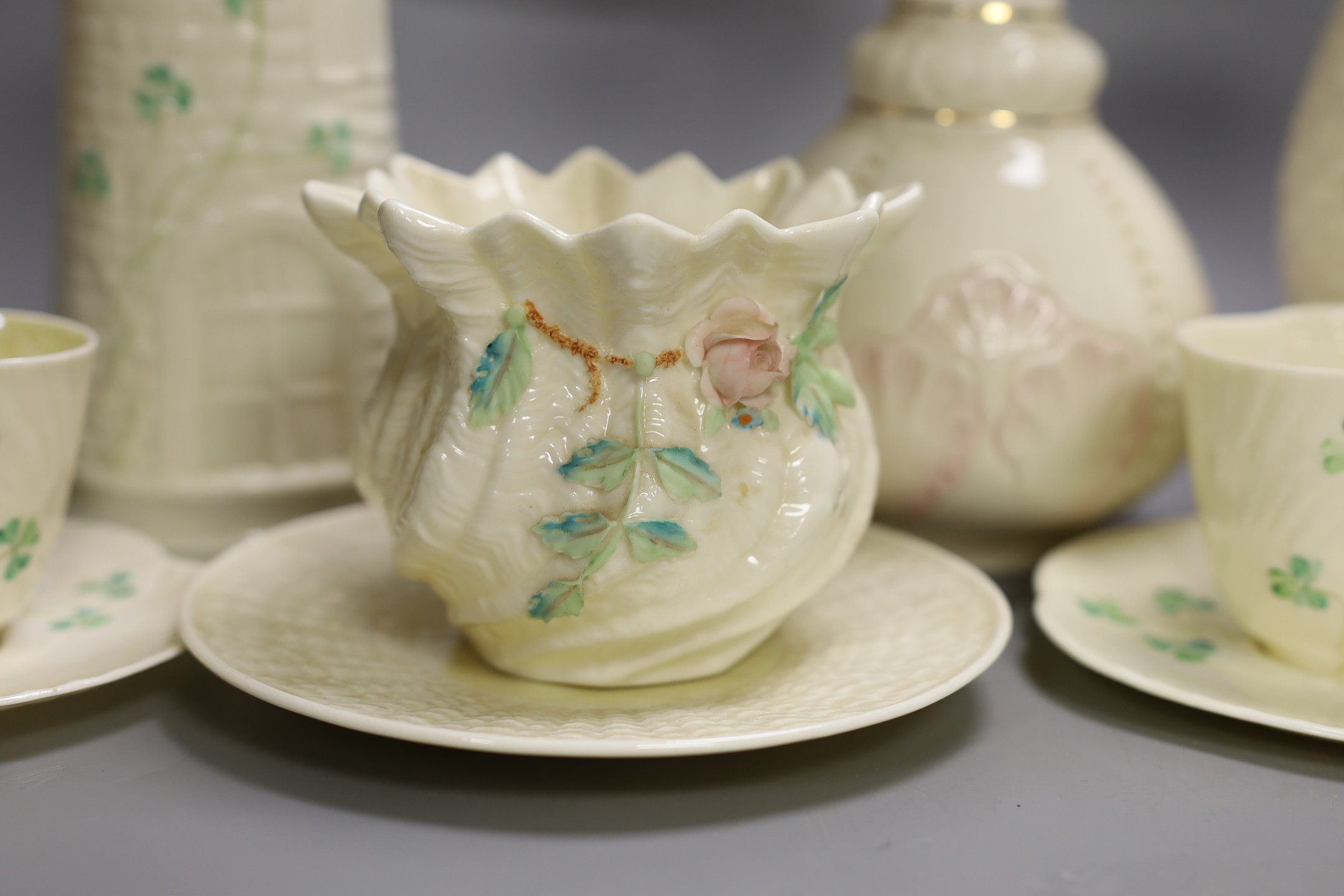 A small collection of Belleek porcelain (9, including saucers)